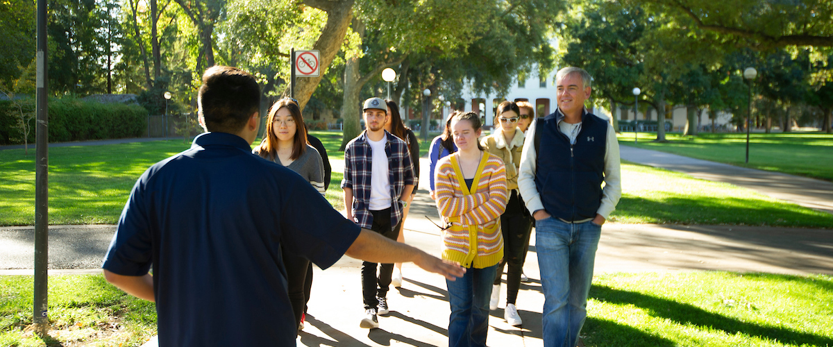 People go on a tour of the campus.